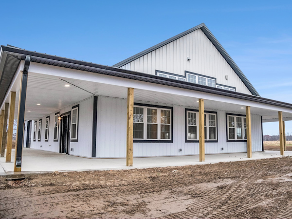 Custom steel barndominium with open concept living and workshop space